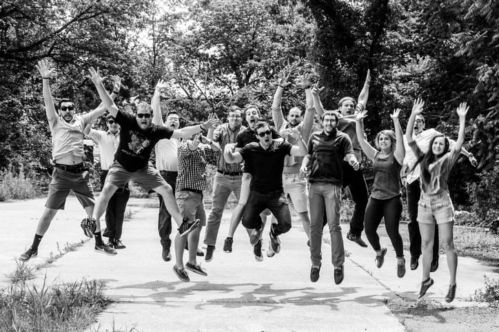 The Designblendz team in 2016 jumping in the air