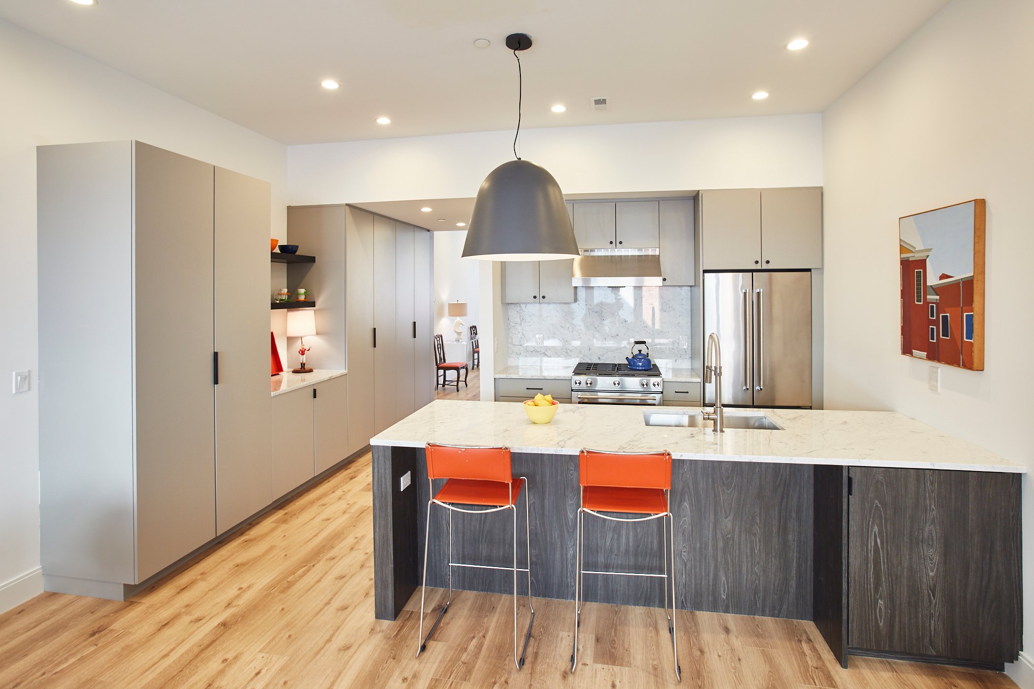 Interior kitchen with orange chairs