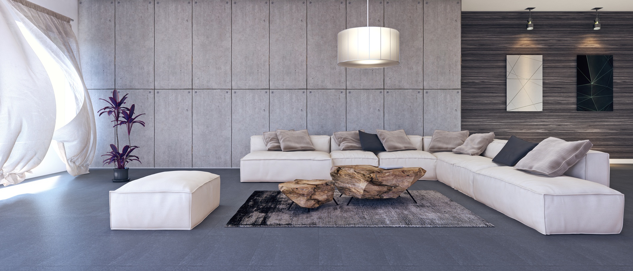 A living space with a white couch and wood coffee table.