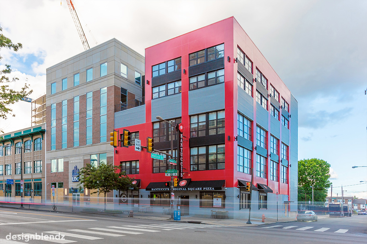 Transformation of a masonry building on N Broad St into modern apartments, complete with a red metal panel design and sweeping city views.